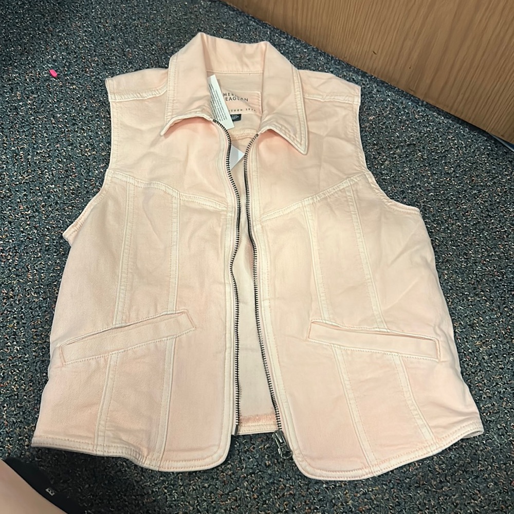 Pink denim vest with tags